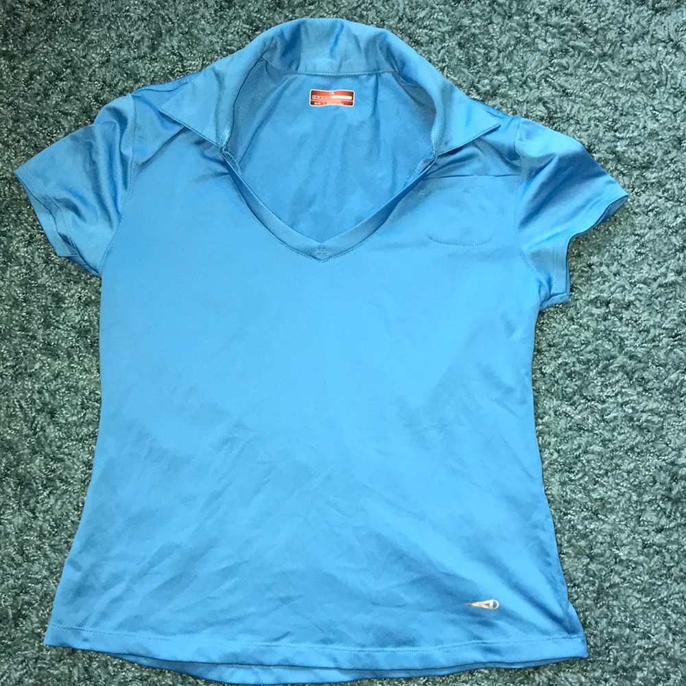 Woman’s blue golf polo